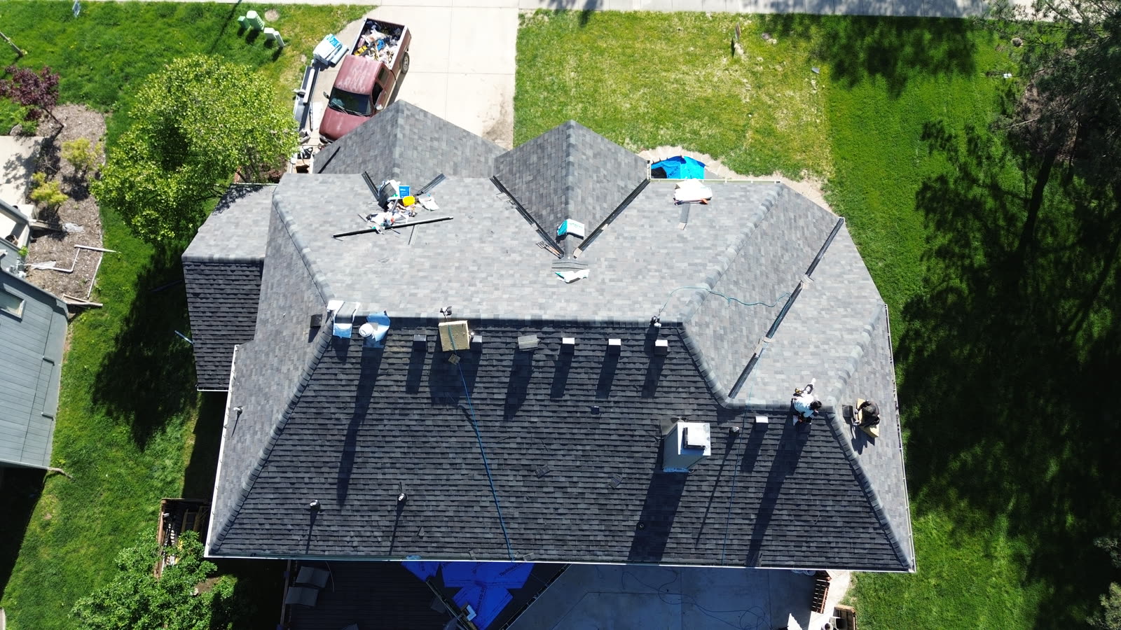 Aerial view of a completed 5 Star Roofing and Construction roof replacement in Kansas City